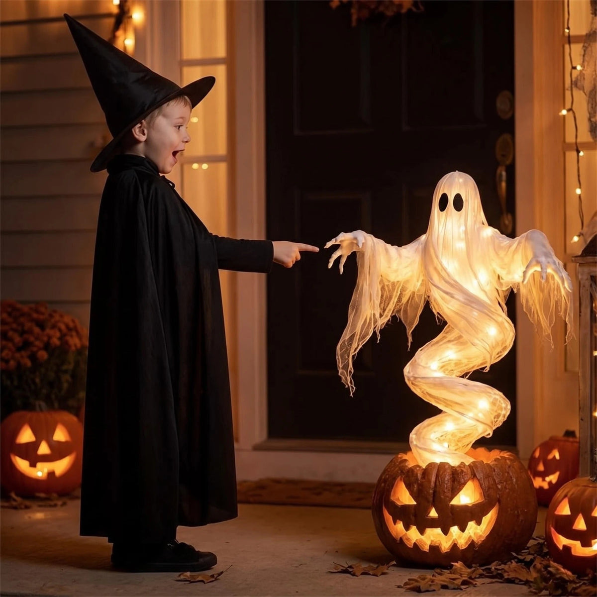 Spooky outdoor Halloween decoration with pumpkin base and floating ghost face for yard and porch display.