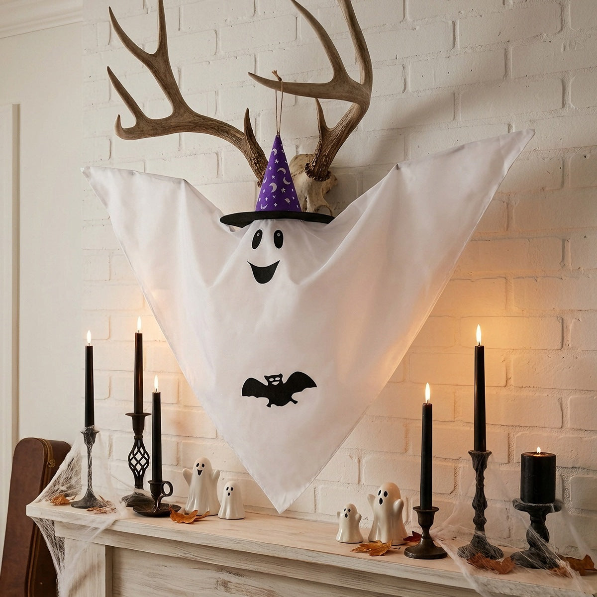 White Halloween hanging ghost with a witch hat for porch or yard decor