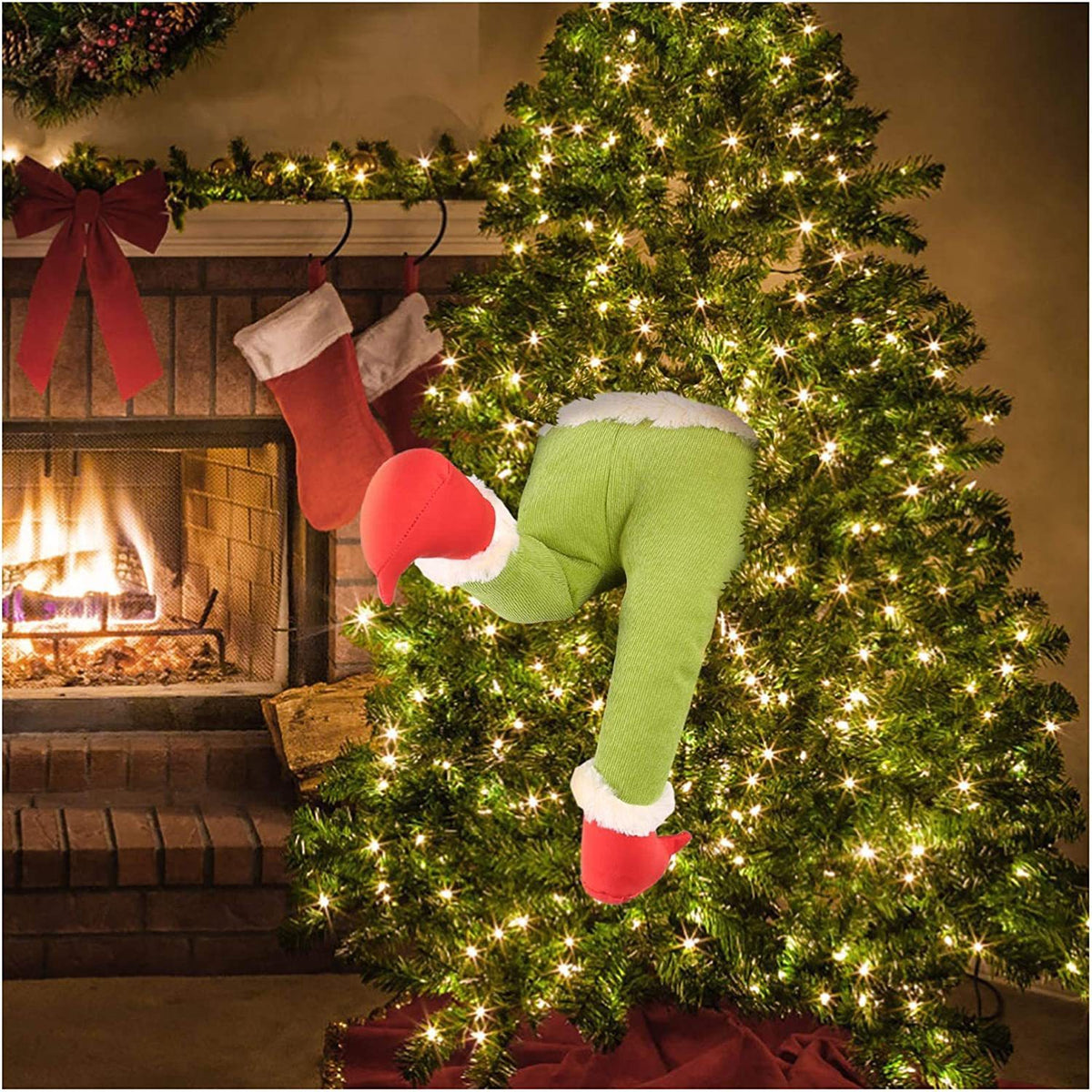Green elf legs Christmas tree decoration for festive holiday displays.