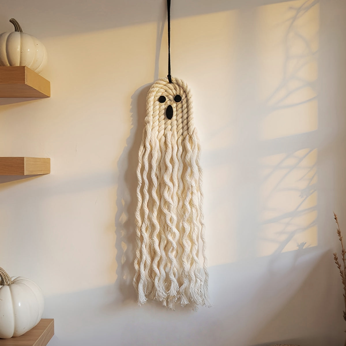 Boho-style woven Halloween ornament with natural fibers, ideal for seasonal home decoration and gifting.