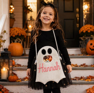 Durable kids treat pouch featuring playful monster face – available in white and orange for party favors.