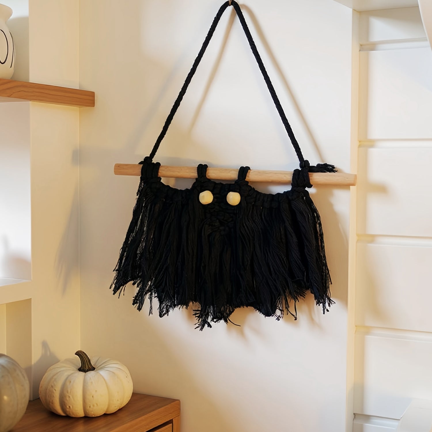 Handmade Halloween woven wall hanging with spooky motifs – perfect fall decor for home and parties.