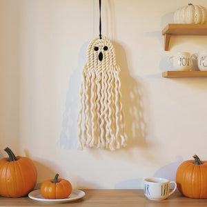 Boho-style woven Halloween ornament with natural fibers, ideal for seasonal home decoration and gifting.